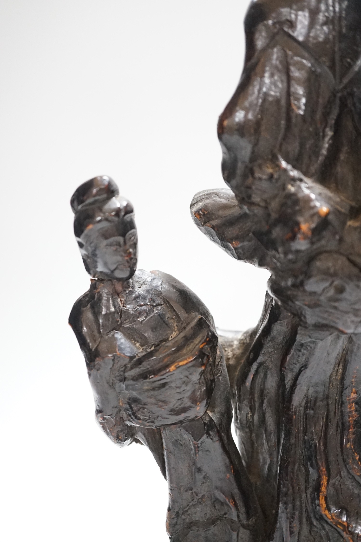 A Chinese root wood carving of two women, 42cm